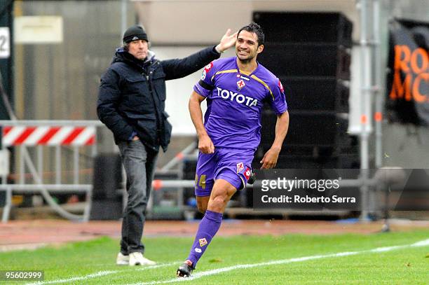 Mario Alberto Santana of AFC Fiorentina celebrate the goal, behind him Alberto Malesani coach of AC Siena disappointed during the Serie A match...