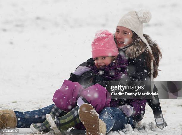 Jools Oliver and children play in the snow on Primrose Hill on January 6, 2010 in London, England.