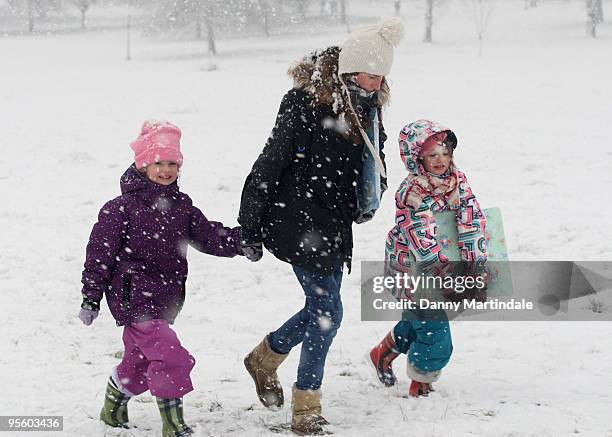 Jools Oliver and children play in the snow on Primrose Hill on January 6, 2010 in London, England.