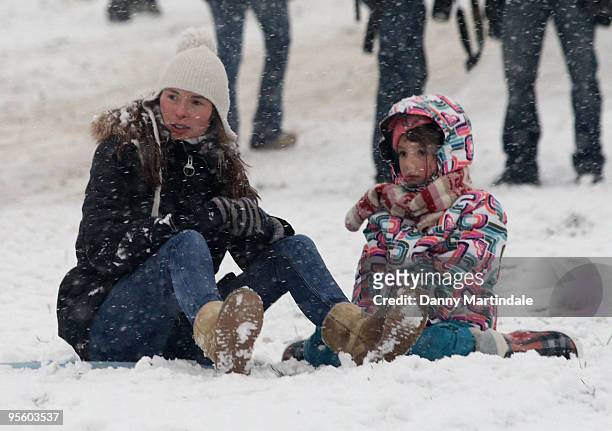 Jools Oliver and children play in the snow on Primrose Hill on January 6, 2010 in London, England.