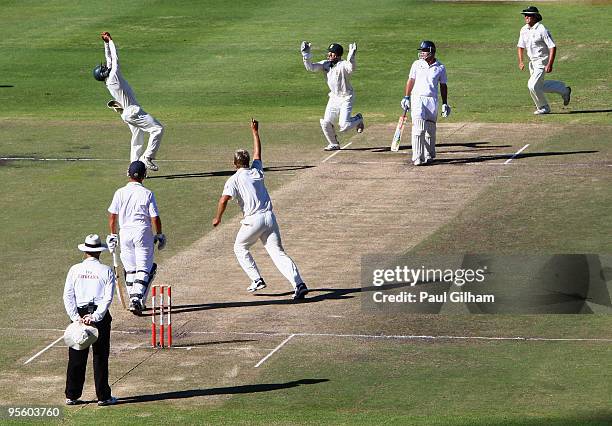 Captain Andrew Strauss of England looks on as he is caught out by Hashim Amla of South Africa for 45 runs off the bowling of Paul Harris of South...