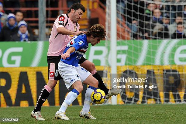 Cesare Bovo of Palermo and Andrea Poli of Sampdoria compete for the ball during the Serie A match between UC Sampdoria and US Citta di Palermo at...