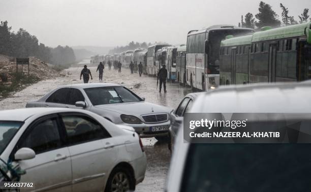 Convoy of buses carrying people evacuated from the central Syria Homs provice arrives at Abu al-Zandin checkpoint near al-Bab in northern Syria on...