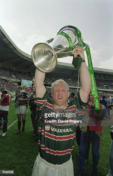 Neil Back of Leicester holds the trophy aloft after the Heineken Cup Final between Stade Francais and Leicester played at the Parc De Princes in...