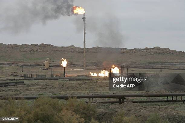 Gas flares burn at the Northern Kirkuk Oil in northern Iraq on January 06, 2010. Iraq has approved all pending deals with foreign energy firms over...