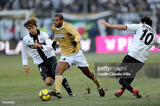 Daniele Galloppa of Parma FC competes for the ball with Felipe Melo of Juventus FC during the Serie A match between Parma and Juventus at Stadio...