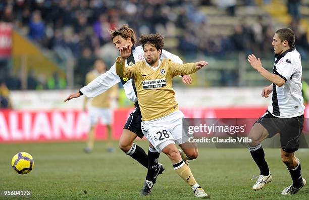 Daniele Galloppa of Parma FC competes for the ball with Diego of Juventus FC during the Serie A match between Parma and Juventus at Stadio Ennio...