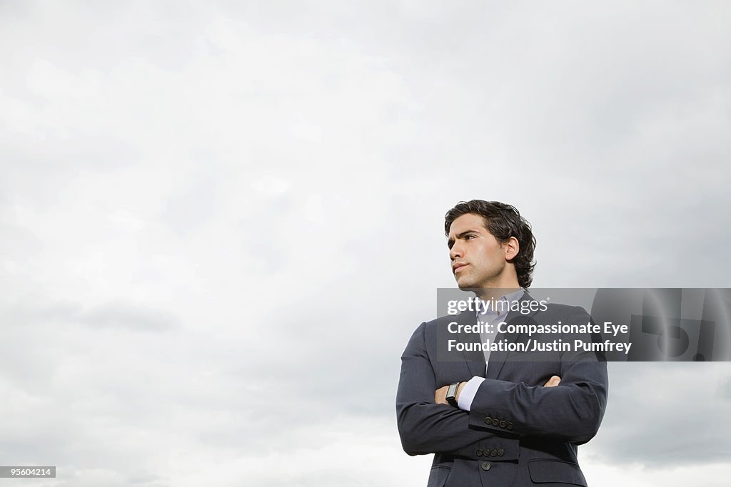 Man in suit with arms crossed