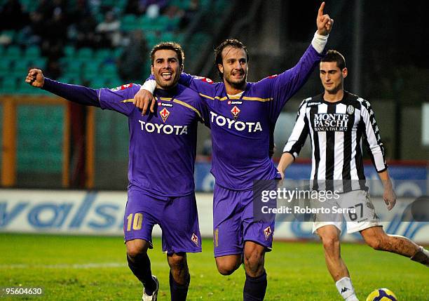 Adrian Mutu and Alberto Gilardino of ACF Fiorentina celebrate the goals scored during the Serie A match between Siena and Fiorentina at Artemio...