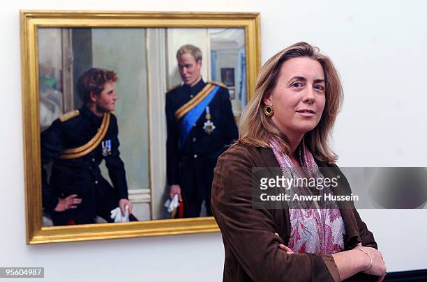 Artist Nicky Phillips stands beside a double portrait she painted of Prince William and Prince Harry which was unveiled at the National Portrait...