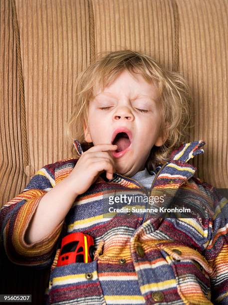a boy yawning sweden. - yawning stock photos et images de collection