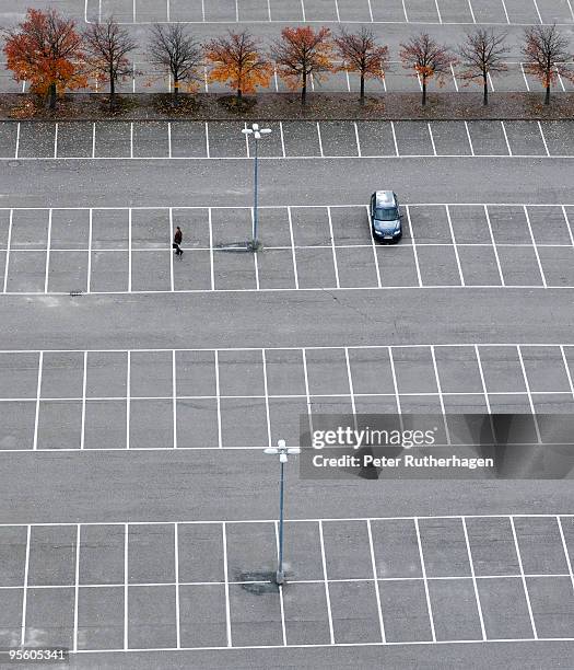 an empty parking lot except for one car sweden. - arlanda airport stock pictures, royalty-free photos & images