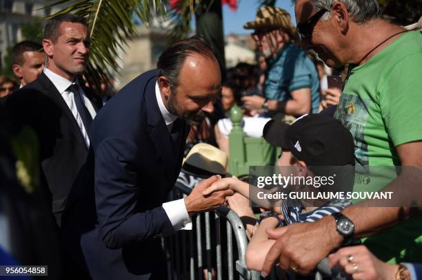 French prime minister Edouard Philippe greets people after taking part in a tribute to Jeanne DArc at the Johannique celebrations on May 8, 2018 in...