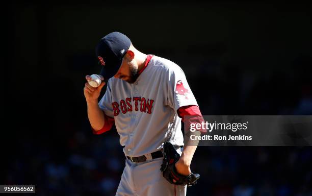 Matt Barnes of the Boston Red Sox pauses between pitches against the Texas Rangers during the eighth inning at Globe Life Park in Arlington on May 6,...