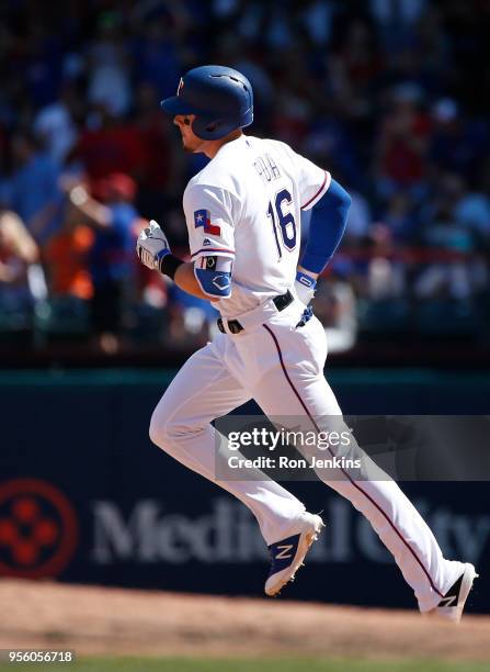 Ryan Rua of the Texas Rangers rounds the bases after hitting a solo home run against the Boston Red Sox during the seventh inning at Globe Life Park...