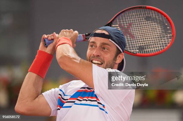 Paolo Lorenzi of Italy returns a shot to Fernando Verdasco of Spain in the 1st Round match during day four of the Mutua Madrid Open tennis tournament...