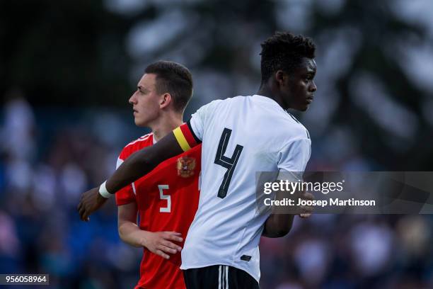 Yann Aurel Bisseck of Germany thanks Ilya Kalatsev of Russia after the U18 international friendly match between Russia and Germany at Zenith Stadium...