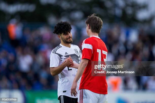 Furkan Sagman of Germany thanks Nikita Tsistjakov of Russia after the U18 international friendly match between Russia and Germany at Zenith Stadium...