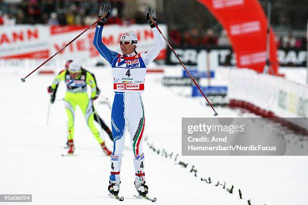 Arianna Follis of Italy celebrates her victory during the 15km women handicap start for the FIS Cross Country World Cup Tour de Ski on January 06,...