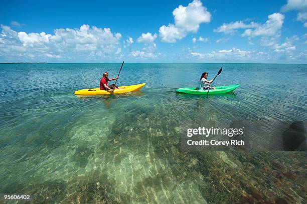 a man and woman kayak in florida. - key west stock-fotos und bilder