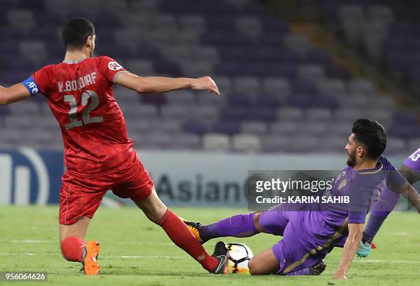 Al-Ain's Amer Abdulrhman vies for the ball against Al-Duhail Karim Boudiaf during the AFC Champions League match Al-Ain vs Al-Duhail at Hazza Bin...