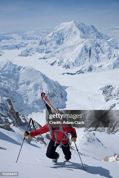 a male skier hiking, denali, alaska. - extreem skiën stockfoto's en -beelden