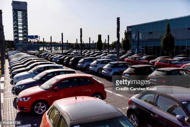 Second hand Audi passenger cars stand on display at an Audi dealership on May 8, 2018 in Berlin, Germany. According to media reports German...