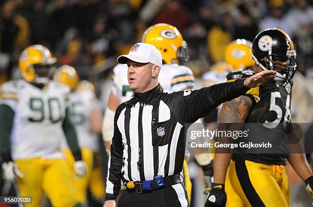 National Football League referee John Parry signals during a game between the Green Bay Packers and the Pittsburgh Steelers at Heinz Field on...