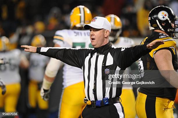 National Football League referee John Parry signals during a game between the Green Bay Packers and the Pittsburgh Steelers at Heinz Field on...
