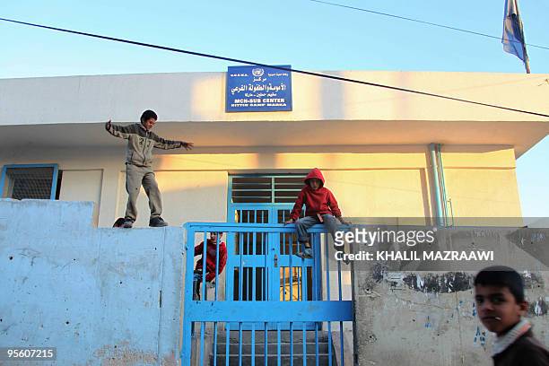 Jordanian boys play on January 5, 2010 outside the gate of an UNRWA clinic, where Jordanian Al-Qaeda triple agent Humam Khalil Abu Mulal al-Balawi...