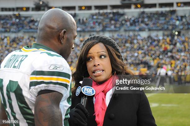 Fox Sports National Football League sideline reporter Pam Oliver interviews wide receiver Donald Driver of the Green Bay Packers before a game...