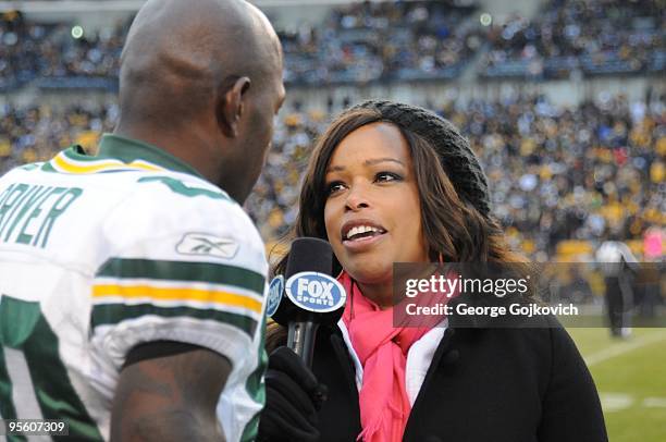 Fox Sports National Football League sideline reporter Pam Oliver interviews wide receiver Donald Driver of the Green Bay Packers before a game...