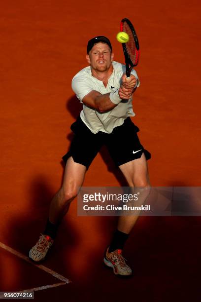 Kyle Edmund of Great Britain plays a backhand in his match against Daniil Medvedev of Russia during day four of the Mutua Madrid Open tennis...
