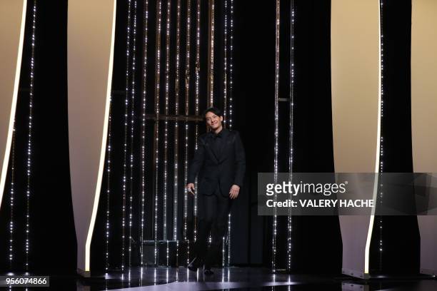 Taiwanese actor and member of the Feature Film Jury Chang Chen arrives on stage on May 8, 2018 for the opening ceremony of the 71st edition of the...
