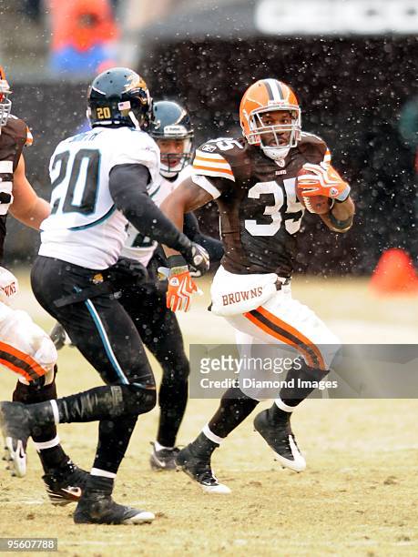 Running back Jerome Harrison of the Cleveland Browns carries the ball as defensive back Anthony Smith of the Jacksonville Jaguars approaches during a...