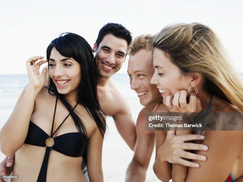 Two young couples smiling and laughing