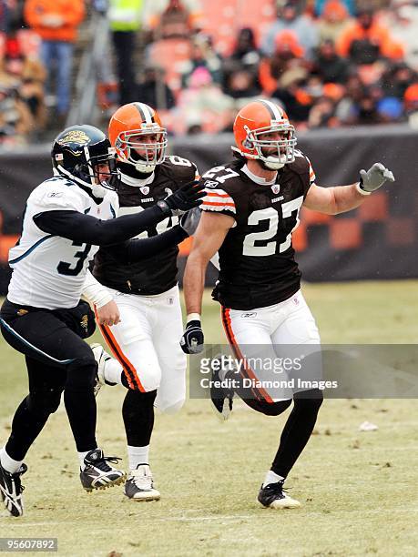 Defensive back Nick Sorensen of the Cleveland Browns runs to cover a punt as defensive back Sean Considine of the Jacksonville Jaguars tries to block...
