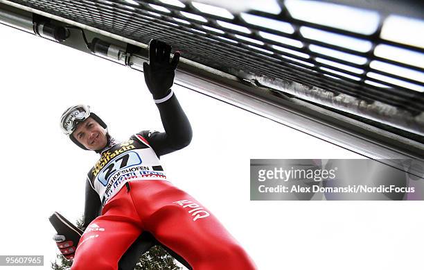 Simon Ammann of Switzerland looks on during the FIS Ski Jumping World Cup event at the 58th Four Hills Ski Jumping Tournament on January 06, 2010 in...