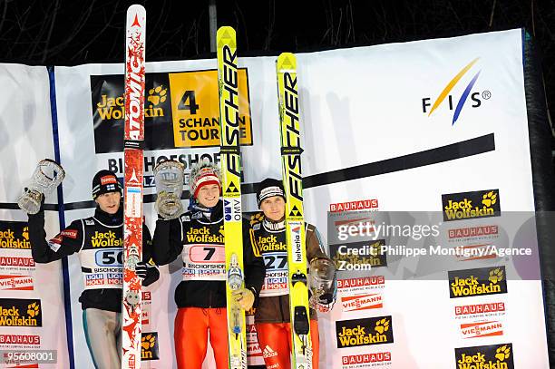 Thomas Morgenstern of Austria takes 1st place, ) Janne Ahonen of Finland takes 2nd place, Simon Ammann of Switzerland takes 3rd place during for the...