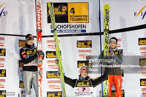 Thomas Morgenstern of Austria takes 1st place, ) Janne Ahonen of Finland takes 2nd place, Simon Ammann of Switzerland takes 3rd place during for the...