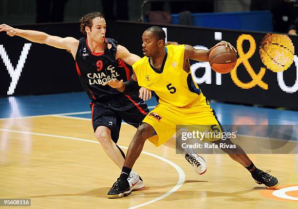 Marcelinho Huertas, #9 of Caja Laboral competes with Billy Keys, #5 of Maroussi BC during the Euroleague Basketball Regular Season 2009-2010 Game Day...