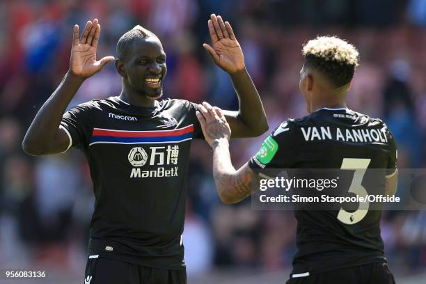 Mamadou Sakho of Palace celebrates victory with teammate Patrick van Aanholt of Palace after the Premier League match between Stoke City and Crystal...