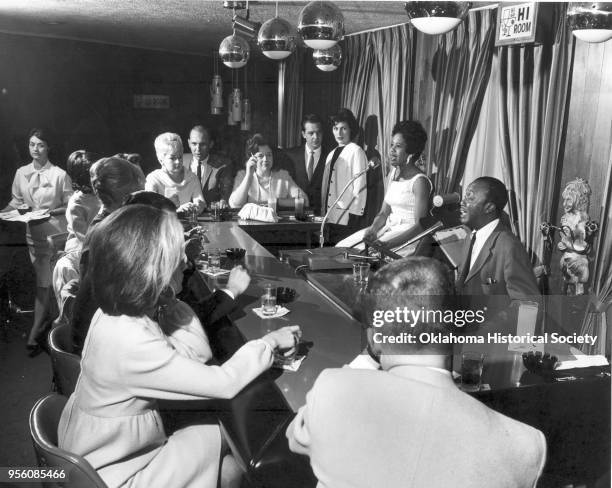 Photograph of Leslie Sheffield playing the piano, at the Hi Lo Club at 3407 North Villa, Oklahoma City, Oklahoma, 1960.