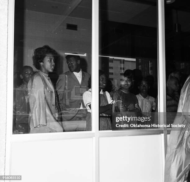 Photograph of Cecil L Williams and A Willie James among a crowd of young people during an African American Civil Rights segregation protest led by...