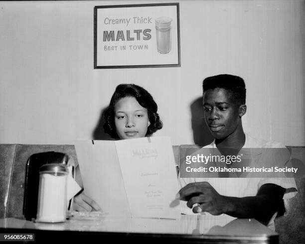 Photograph of Barbara Posey and Dwayne Crosby during a sit-in at John A Brown Company, Oklahoma City, Oklahoma, late 1950s or early 1960s.