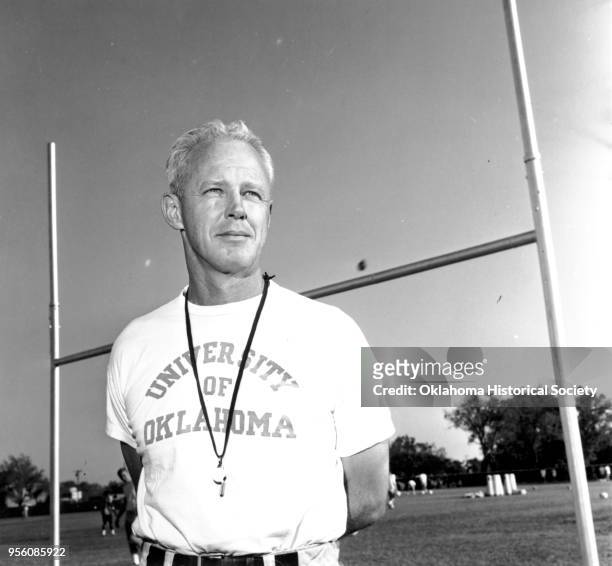 Photograph of Bud Wilkinson wearing a University of Oklahoma tee shirt, 1940s or 1950s.