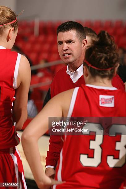 Head coach Ryun Williams of the South Dakota Coyotes speaks to his team during a timeout in the game against the Cal State Northridge Matadors on...