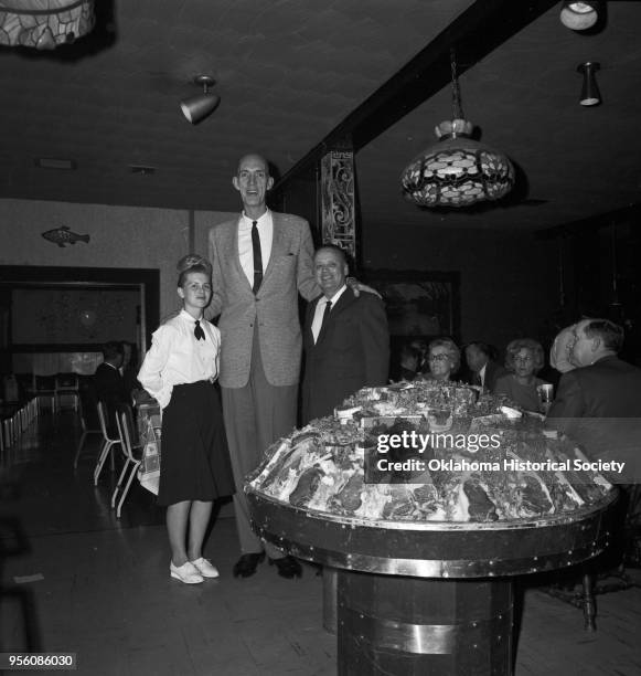 Photograph of 'Tall Man' Henry Hite at Glen's Hickory Inn at 2815 NW 10th Street, Oklahoma City, Oklahoma, mid twentieth century.