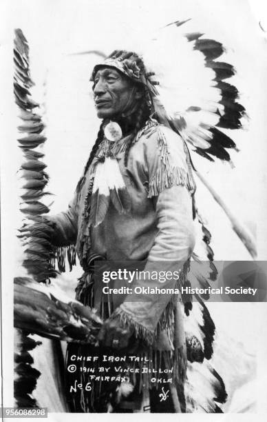 Photograph of Sioux Chief Iron Tail at the 101 Ranch, Ponca City, Oklahoma, 1914. He is wearing a war bonnet, feathers, and fringed buckskins.