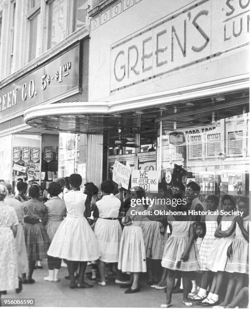 Photograph of Civil Rights protesters in front of Green's, Oklahoma City, Oklahoma, circa 1964